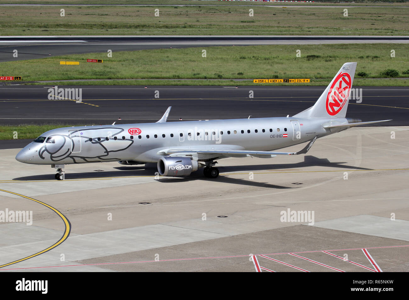 Austrian Niki Embraer ERJ-190 with registration OE-IHD on taxiway of Dusseldorf Airport. Stock Photo