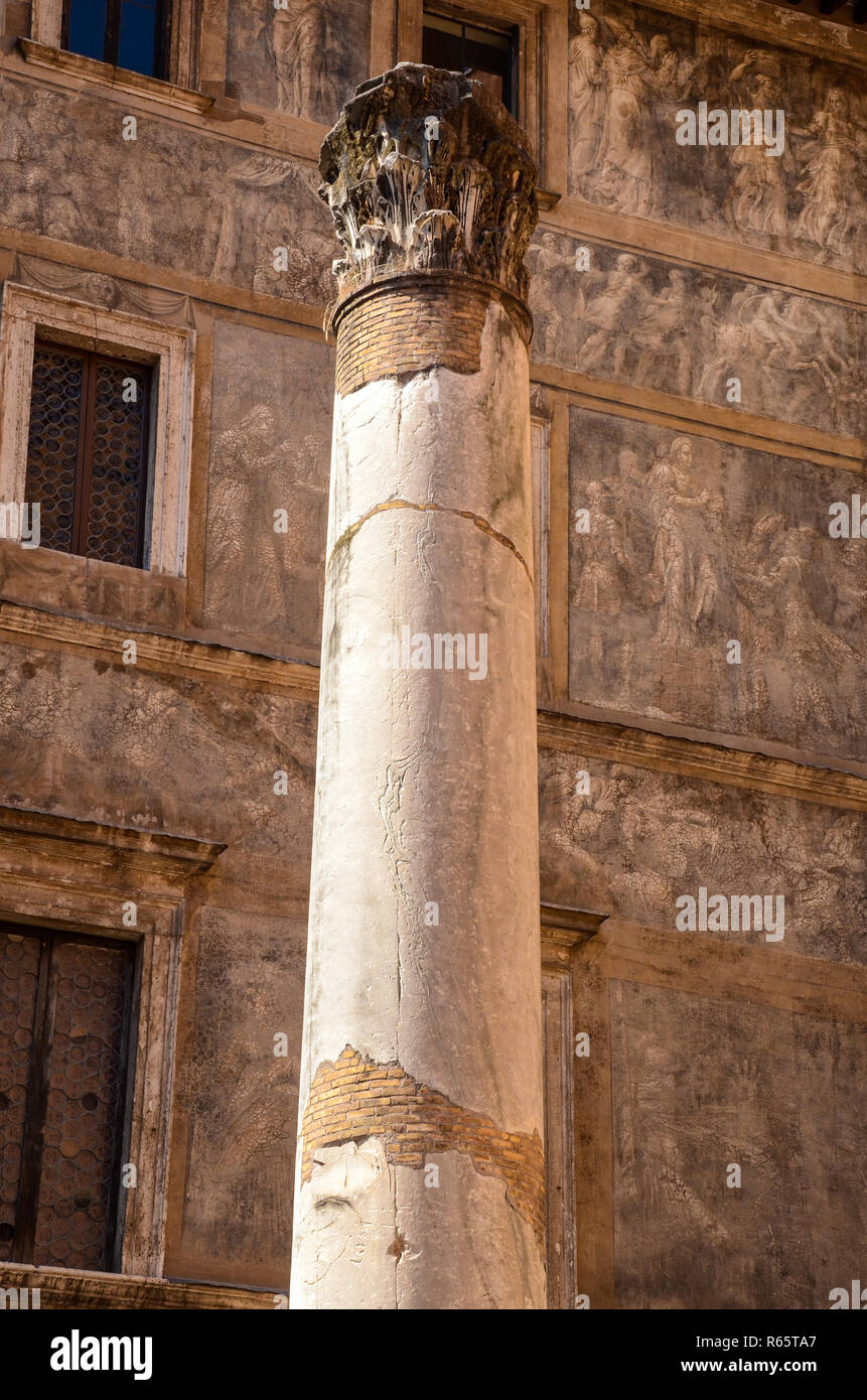 Ancient Corinthian column and frescoed wall in Rome, Italy Stock Photo