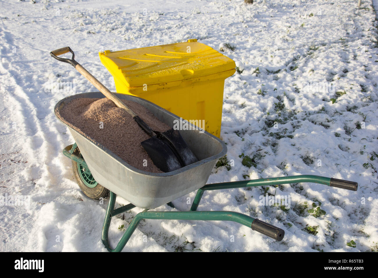 yard keeper working tools to work on slippery sidewalk Stock Photo Alamy
