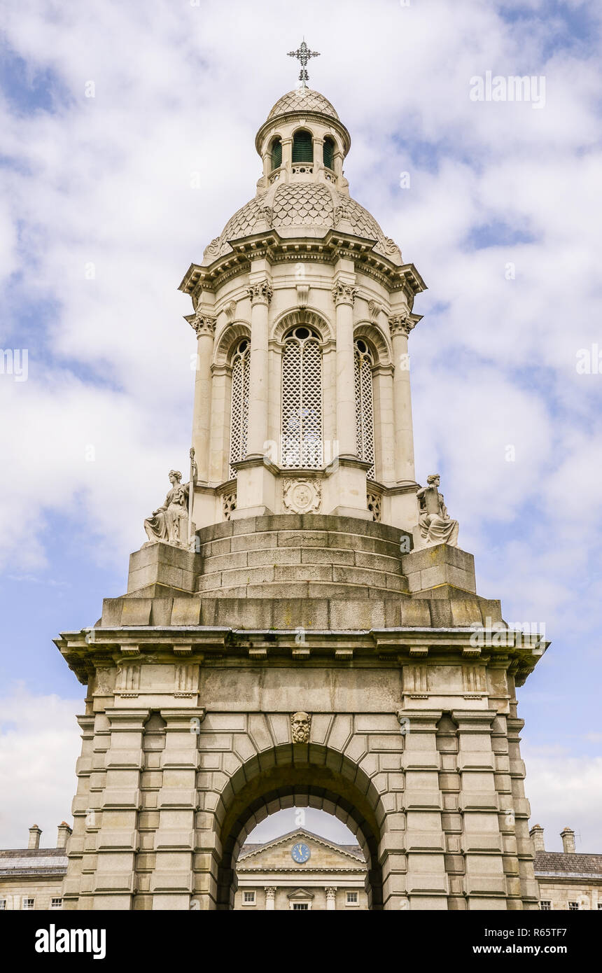 Ornate bell tower under blue sky and puffy white clouds - The Trinity College Campanile in Dublin, Ireland Stock Photo