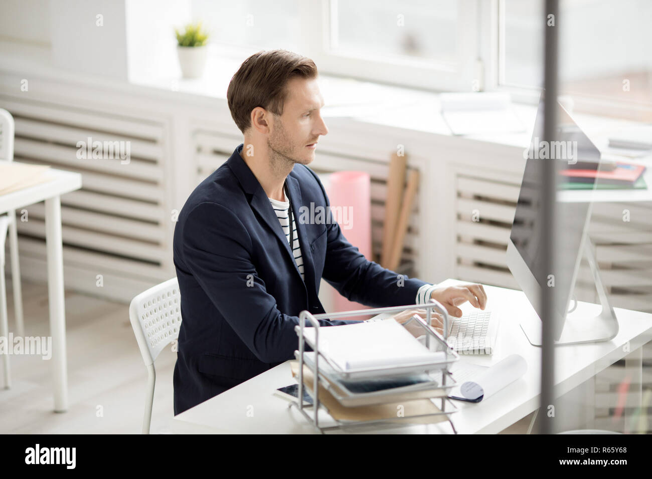 Handsome Man at Workplace Stock Photo