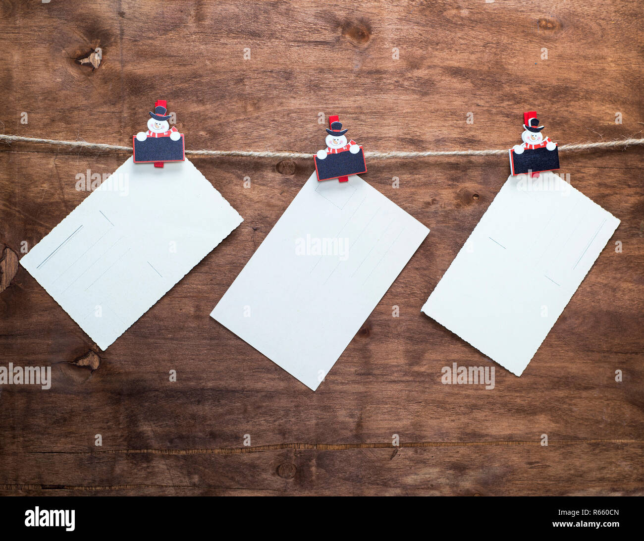 paper vintage postcards hanging on a rope Stock Photo Alamy