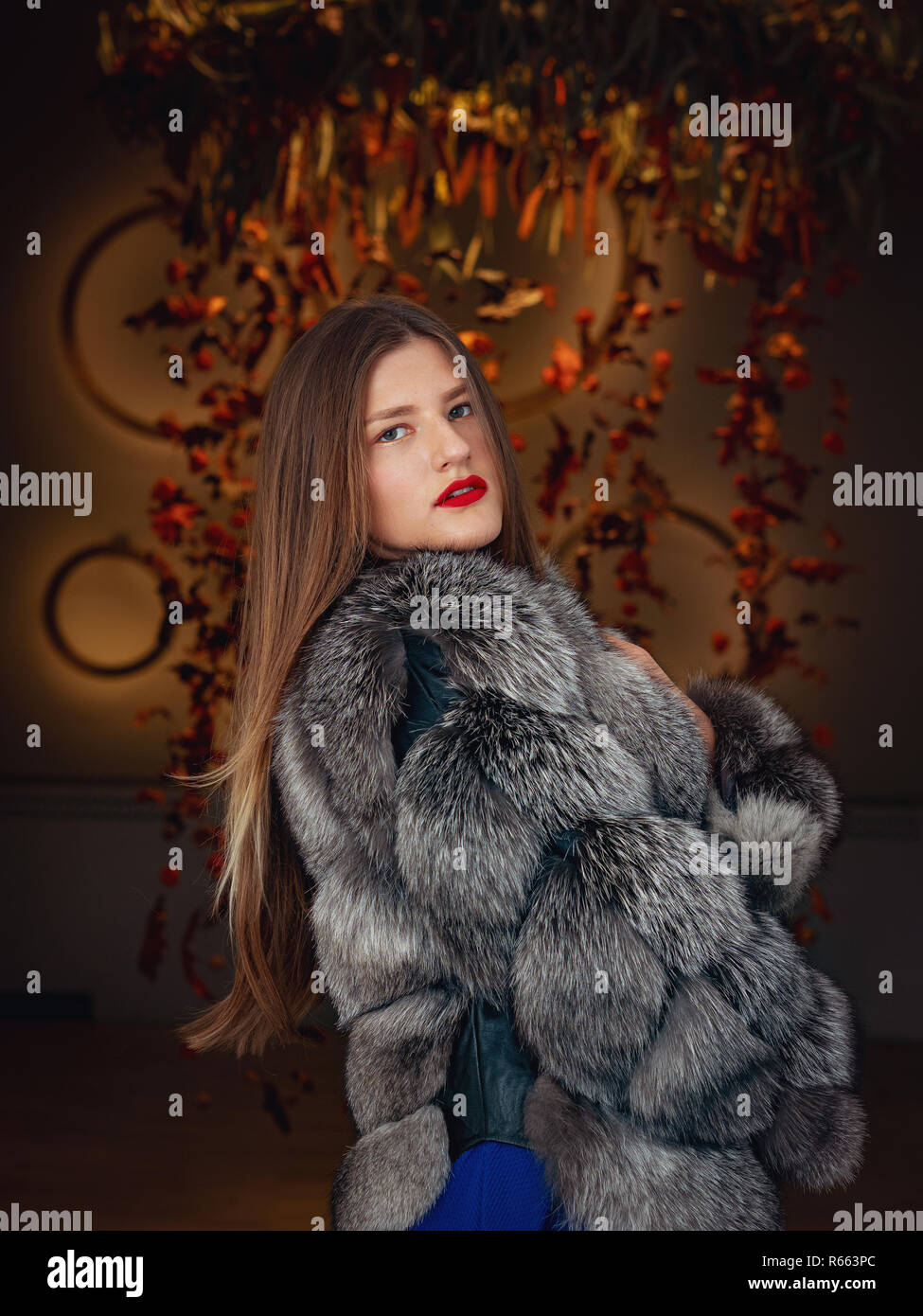 Blonde woman wearing a fur coat Stock Photo - Alamy