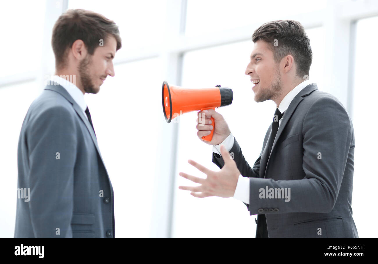 Man shouting colleague megaphone hi-res stock photography and images ...