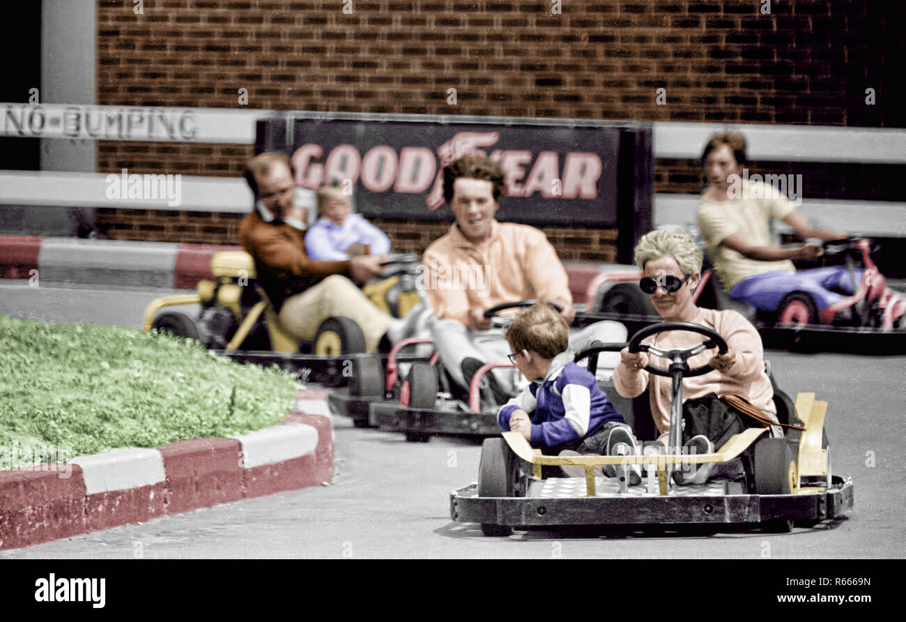 A colourised version of the original black and white copy, also on alamy,  of the Hastings seafront go karts. Note no crash helmets. Stock Photo