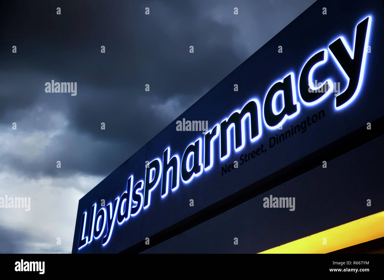 illuminated Lloyds chemist sign at dusk in Dinnington, Rotherham UK