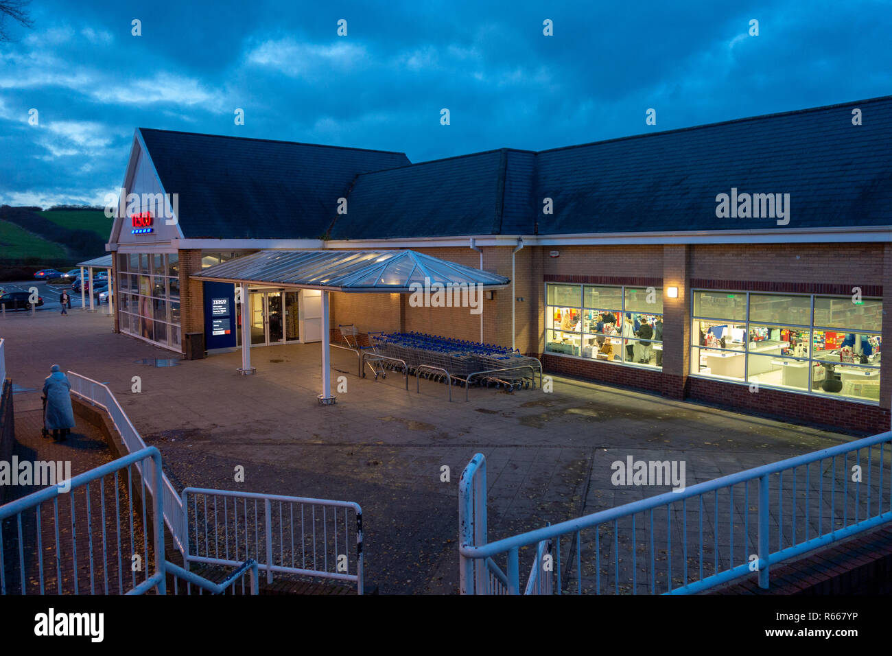 shop front Dusk image of an illuminated Tesco Supermarket at Dinnington