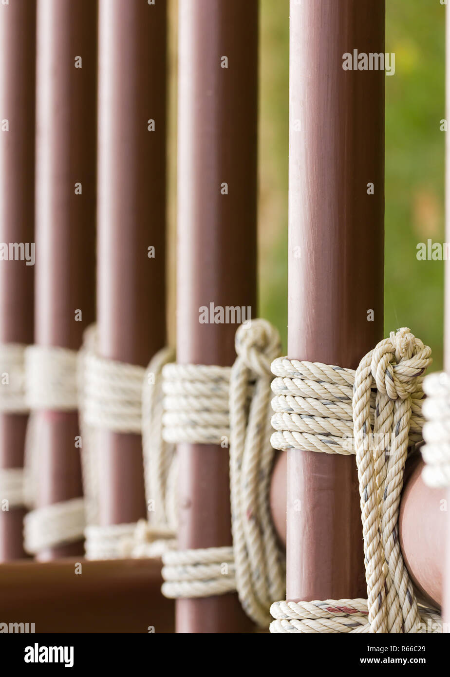 Rope knot around a metal fence Stock Photo Alamy