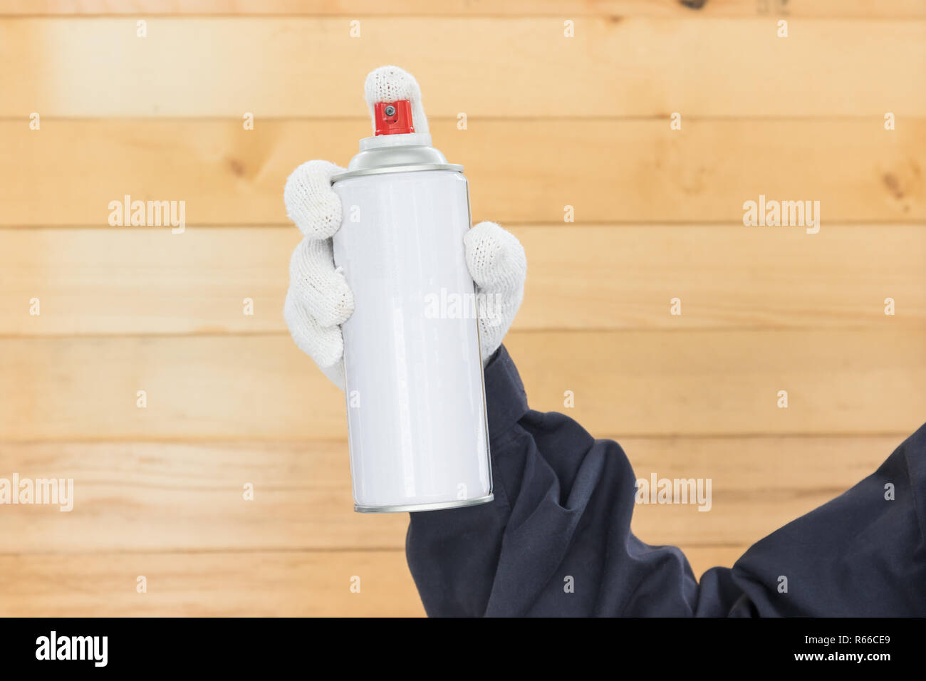 Hand holding spray paint can Stock Photo - Alamy