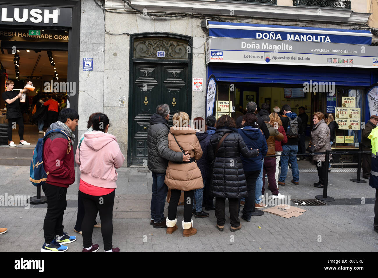 People seen waiting in a long queue in front of the famous 'Doña Manolita'  lottery shop in Madrid Stock Photo - Alamy
