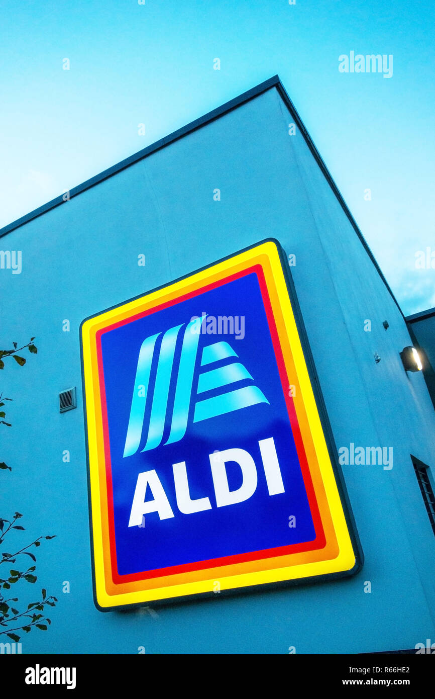 illuminated Aldi Sign at dusk in Dinnington, Rotherham UK Stock Photo