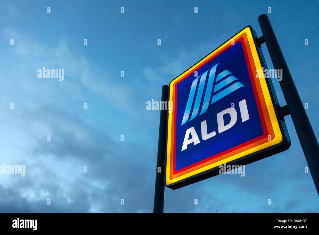 illuminated Aldi Sign at dusk in Dinnington, Rotherham UK Stock Photo