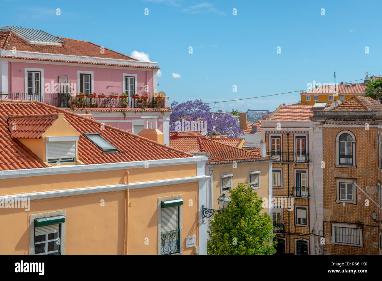 Colorful buildings with red tile roofs in the Alfama district of Lisbon, Portugal Stock Photo