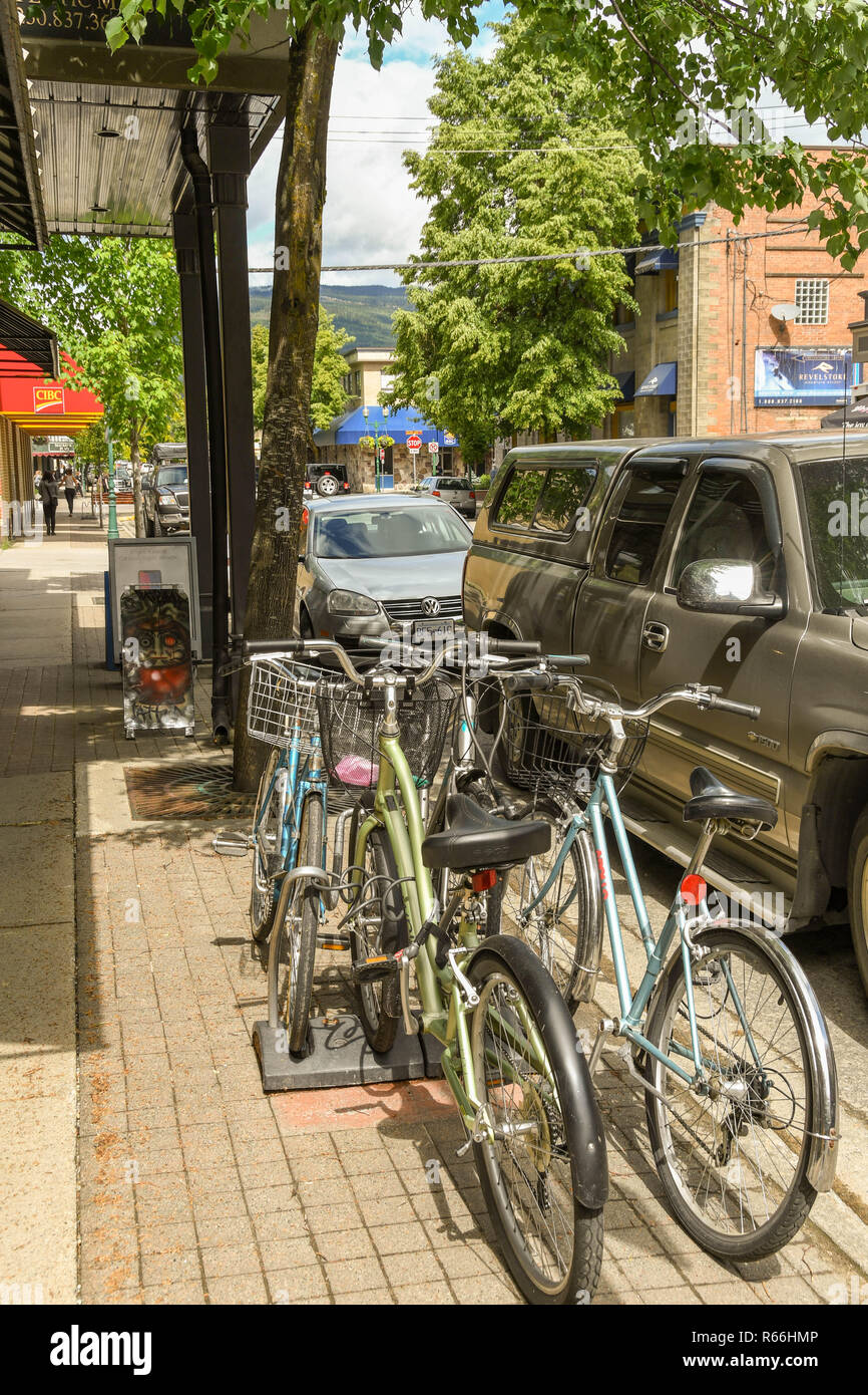 REVELSTOKE, BRITISH COLUMBIA, CANADA JUNE 2018 Bicycles locked to a