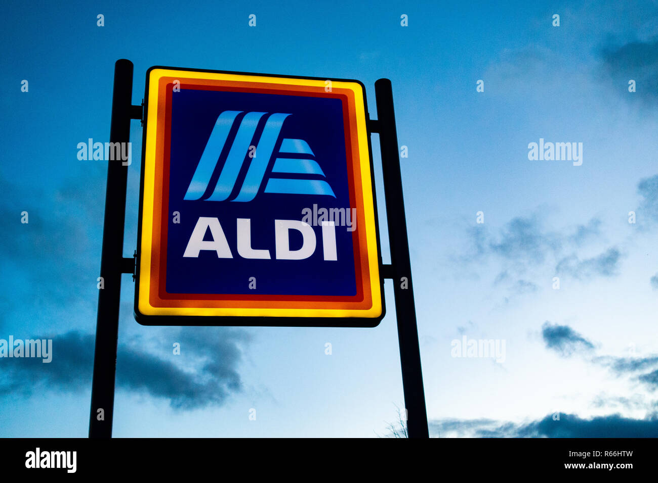 illuminated Aldi Sign at dusk in Dinnington, Rotherham UK Stock Photo