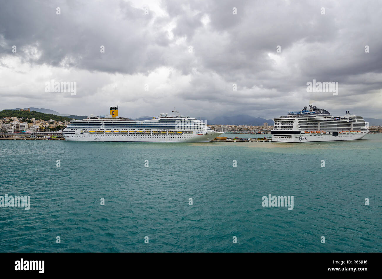 Palma, Spain -  October 31, 2018:  Cruise liners Costa Magica and MSC Meraviglia anchored  in the port of Palma de Mallorca, the Balearic Island Stock Photo