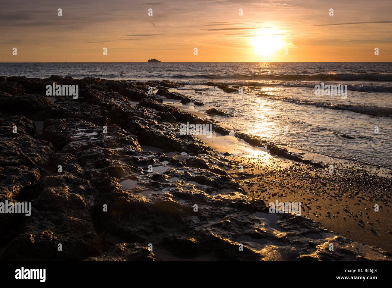 Sunrise seen over St. Helen's Fort from the beach at The Duver, Isle of Wight Stock Photo