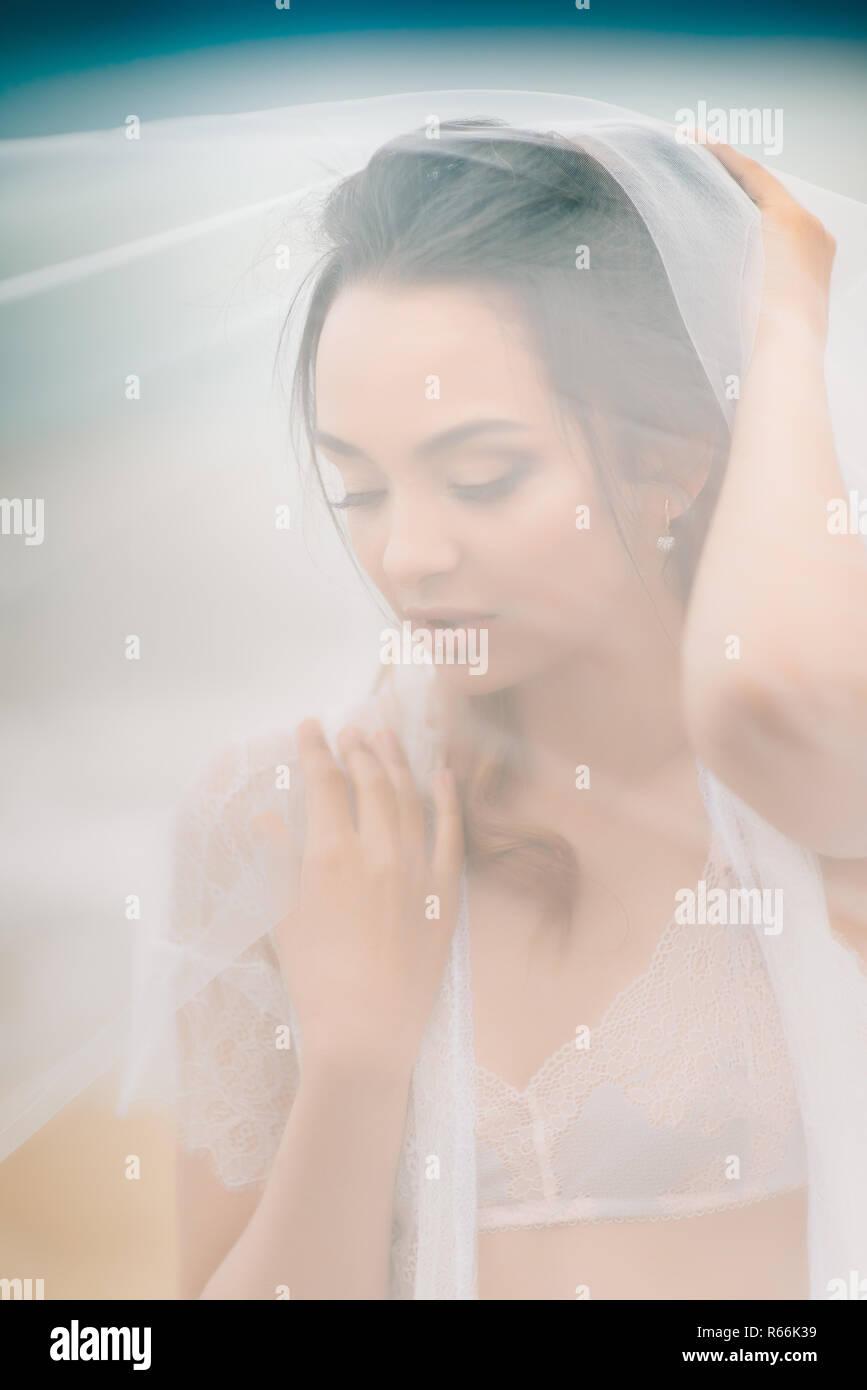 Woman under white veil hi-res stock photography and images - Alamy