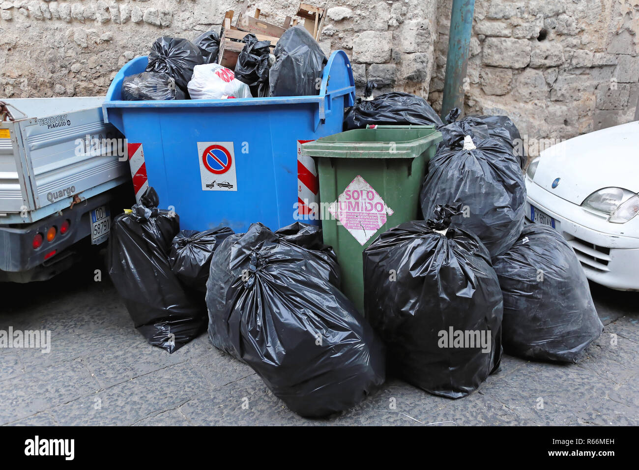 Overloaded with bags of waste, vehicle moves on higway, Shiraz, Iran. –  Stock Editorial Photo © grigvovan #167601202