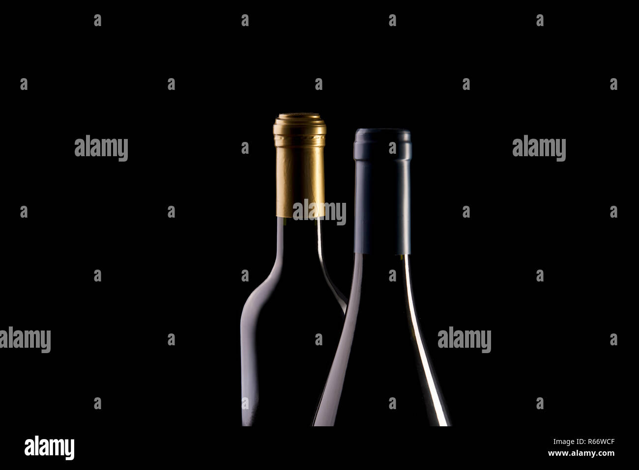 bottles of wine on a black background Stock Photo - Alamy