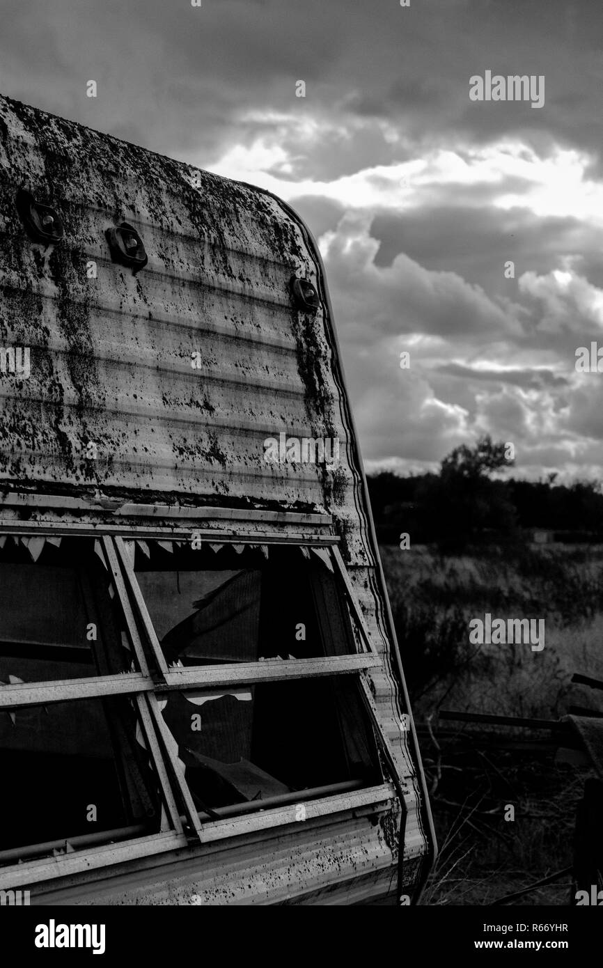 Trailer left behind my house in black and grey Stock Photo