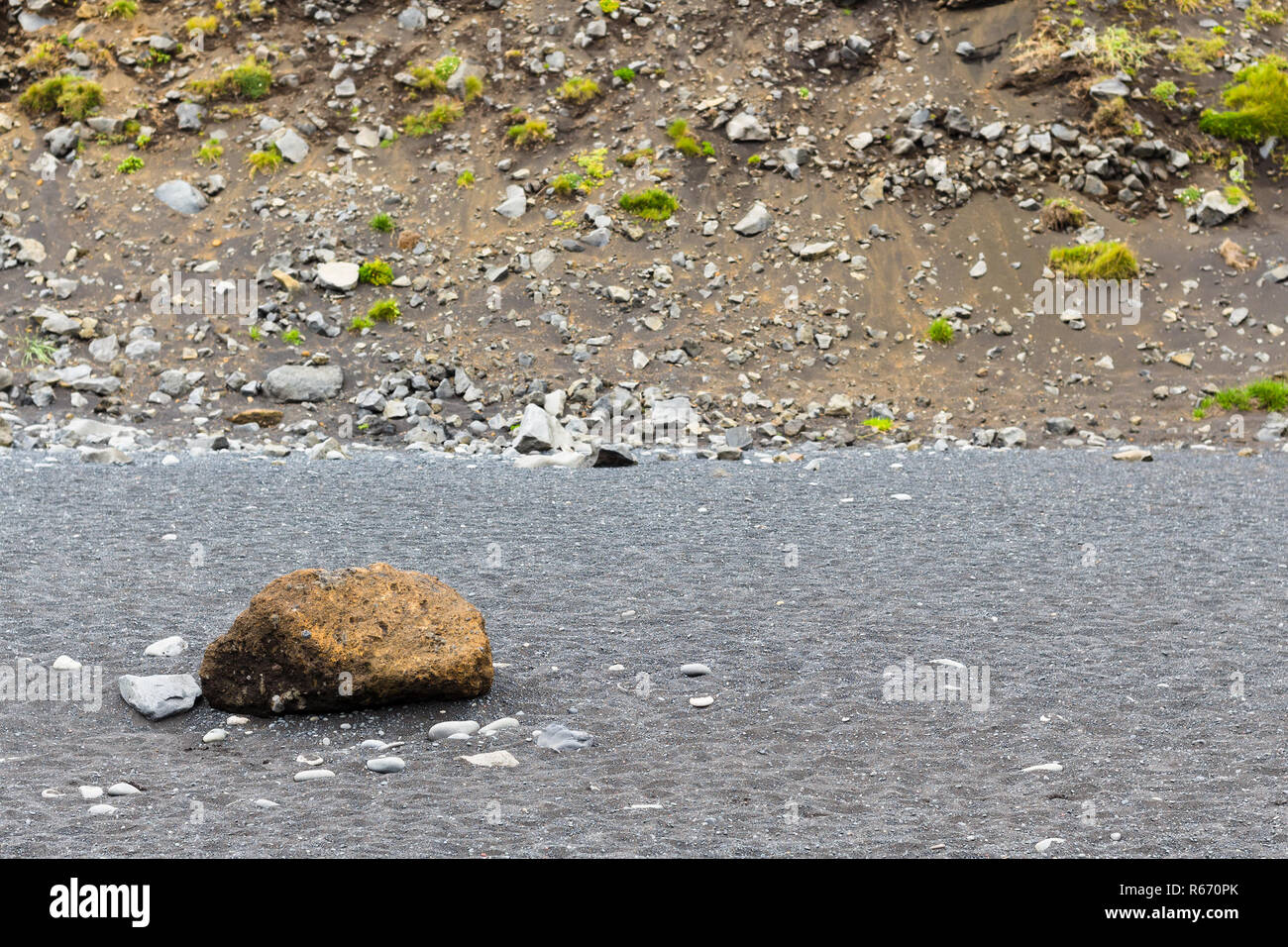 cobble on Reynisfjara Beach near slope of mount Stock Photo