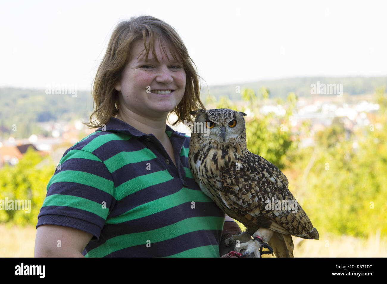 young woman with eagle owl Stock Photo