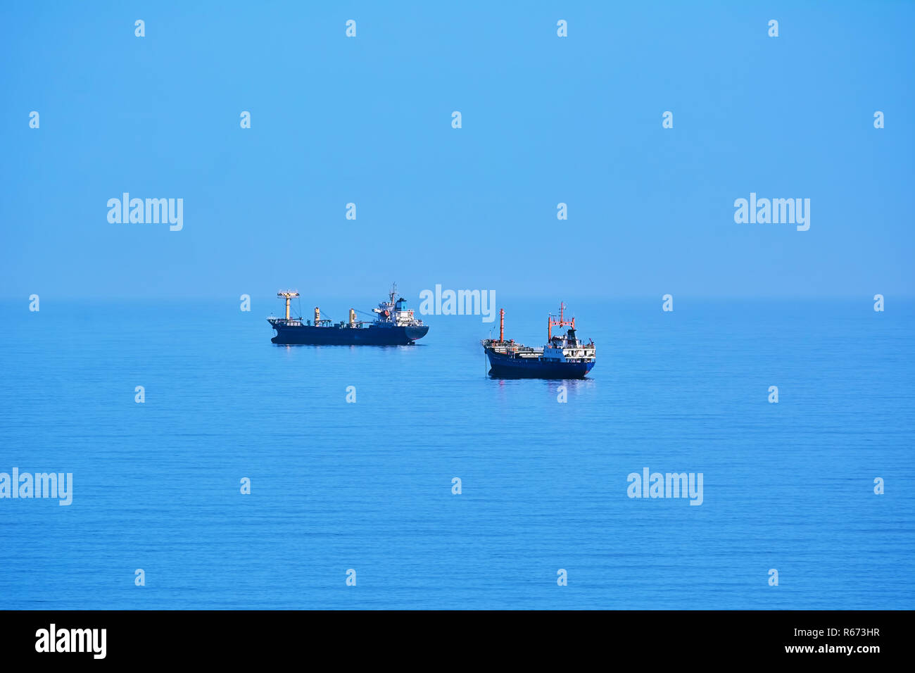 Cargo ships sailing out sea hi-res stock photography and images - Alamy