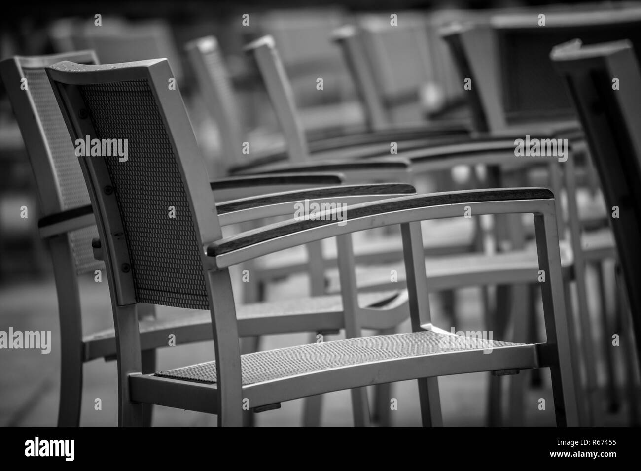 Empty chairs outside cafe Stock Photo