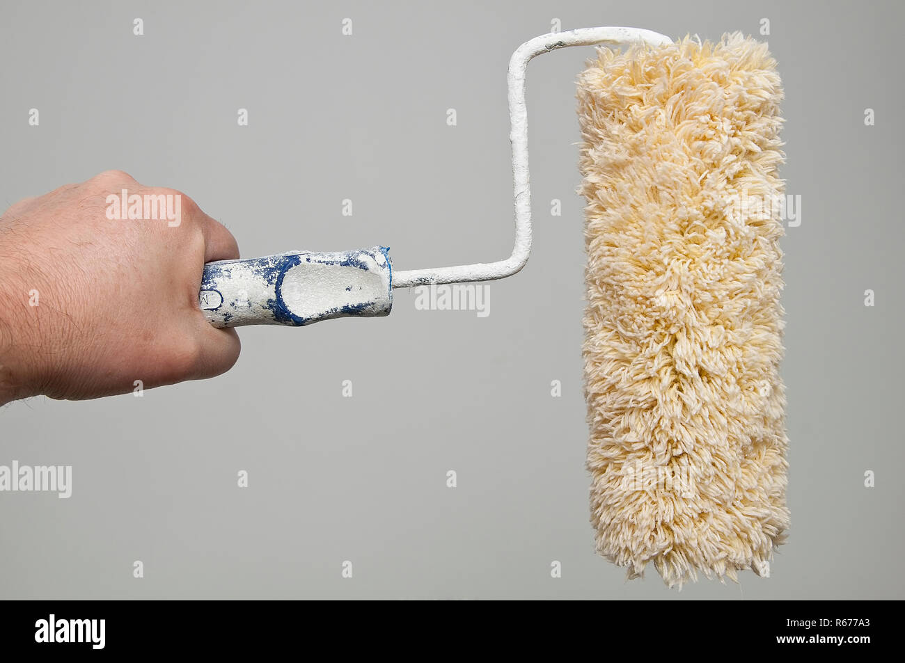 a wall painting roller Stock Photo Alamy