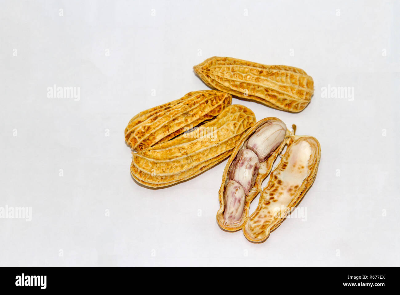 Peanuts boiled and peeled on a white background. Stock Photo