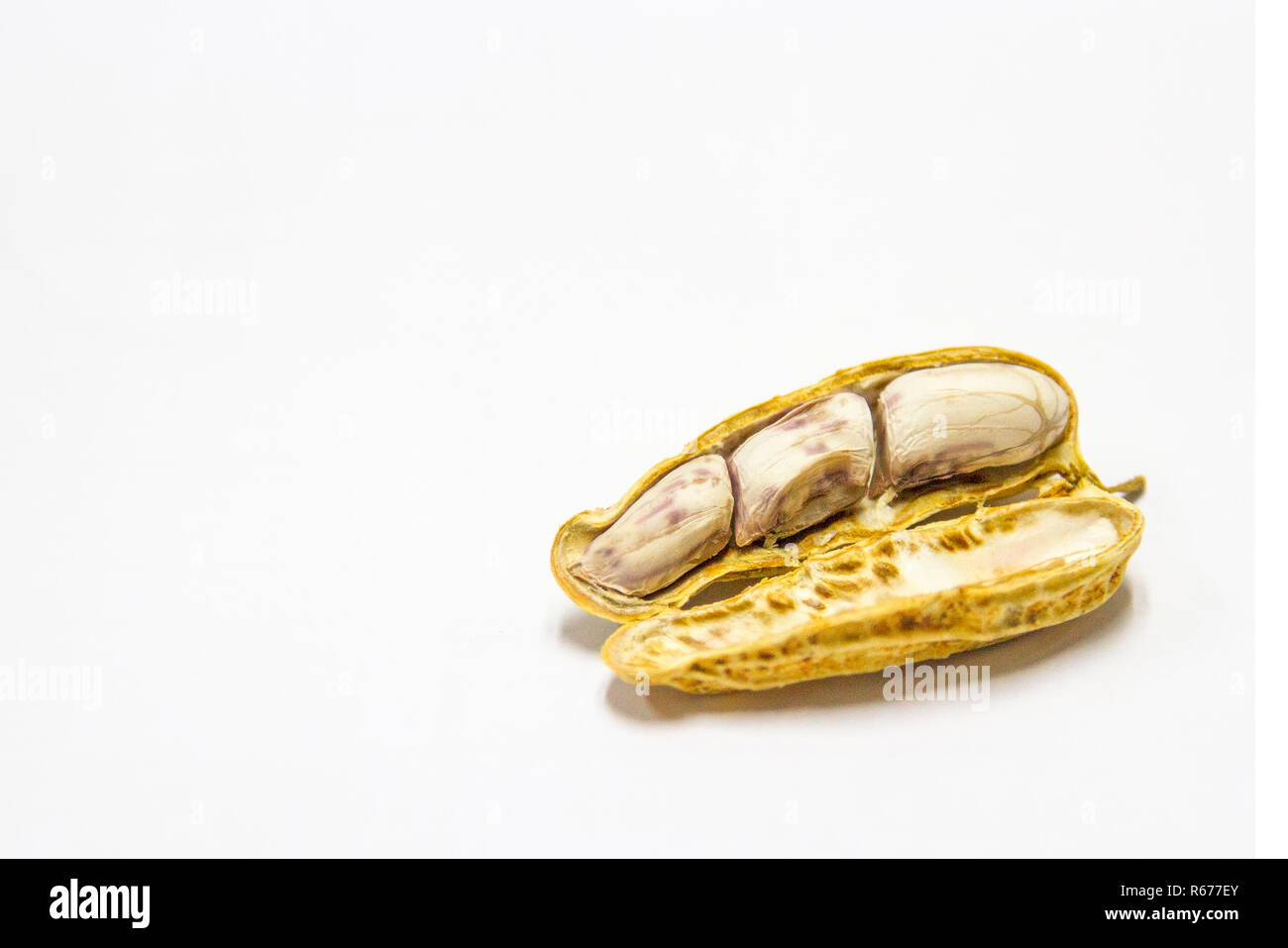 Peanuts boiled and peeled on a white background. Stock Photo