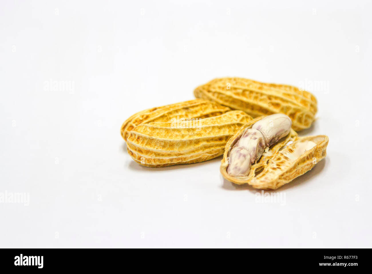 Peanuts boiled and peeled on a white background. Stock Photo