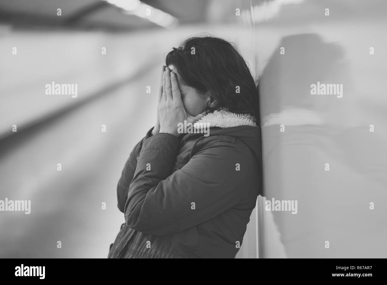 Unhappy young woman suffering from depression and stress feeling miserable lonely and hopeless in Emotional pain Mental health Work-life balance issue Stock Photo