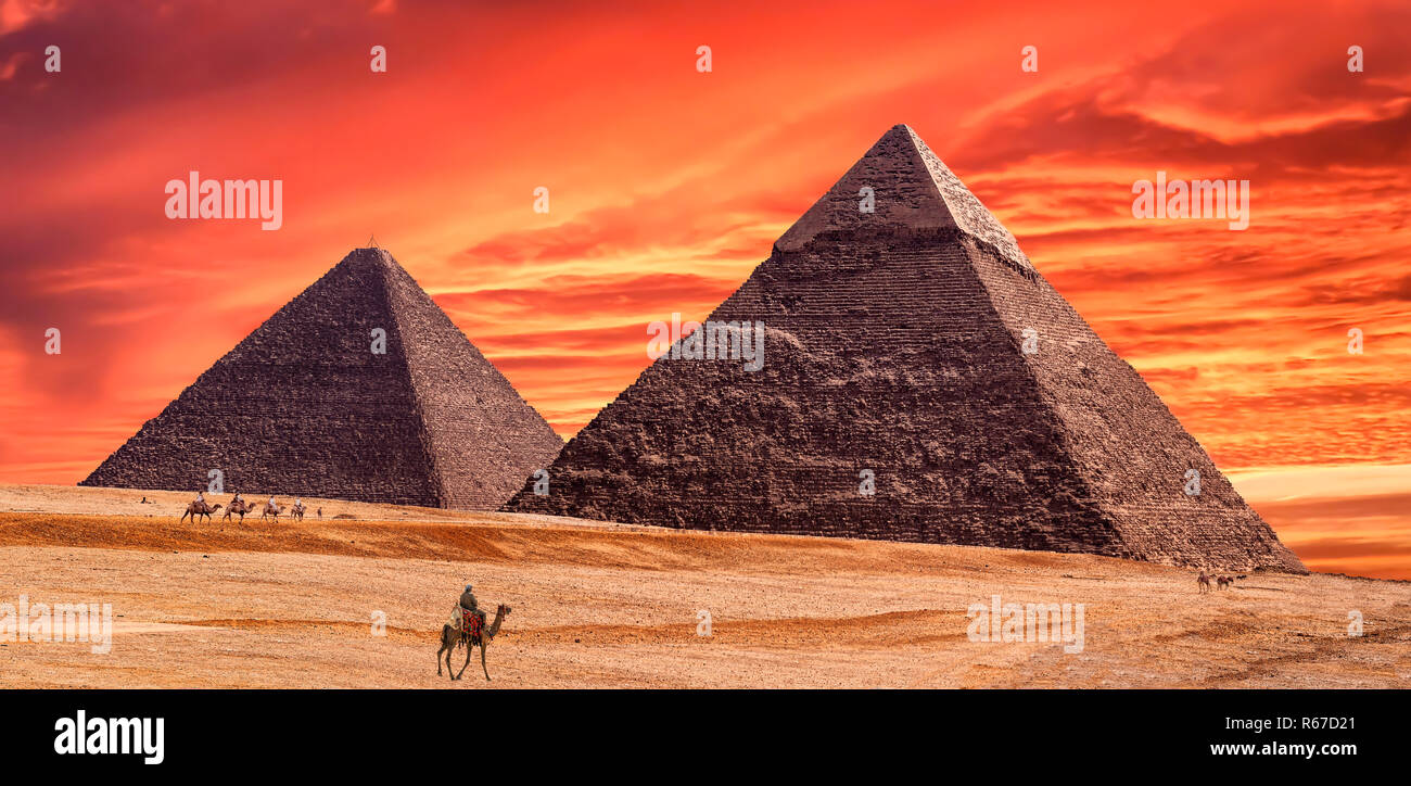 Panorama of the area with the great pyramids of Giza at amazing sunset ...