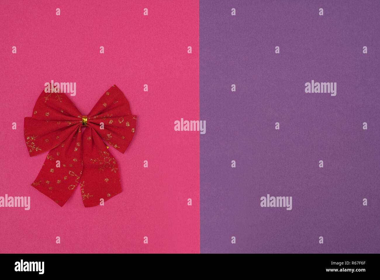 Christmas bows on a colored background Stock Photo Alamy — free download