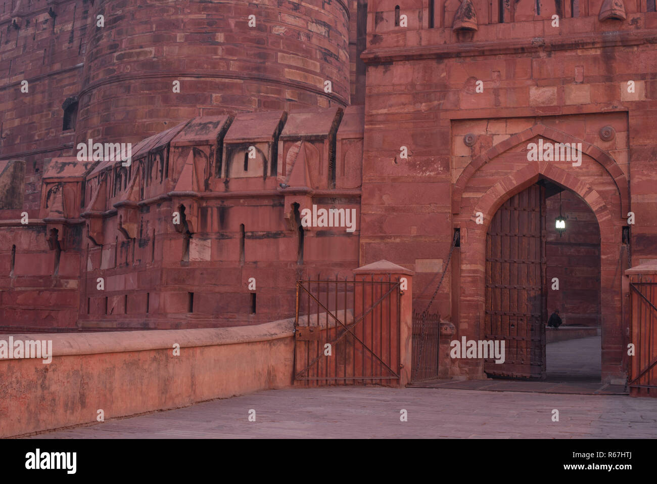 The entrance of Agra Fort also called as the Red Fort the residence of the Mughal Dynasty with amazing mughal architecture made of red stones at dawn  Stock Photo