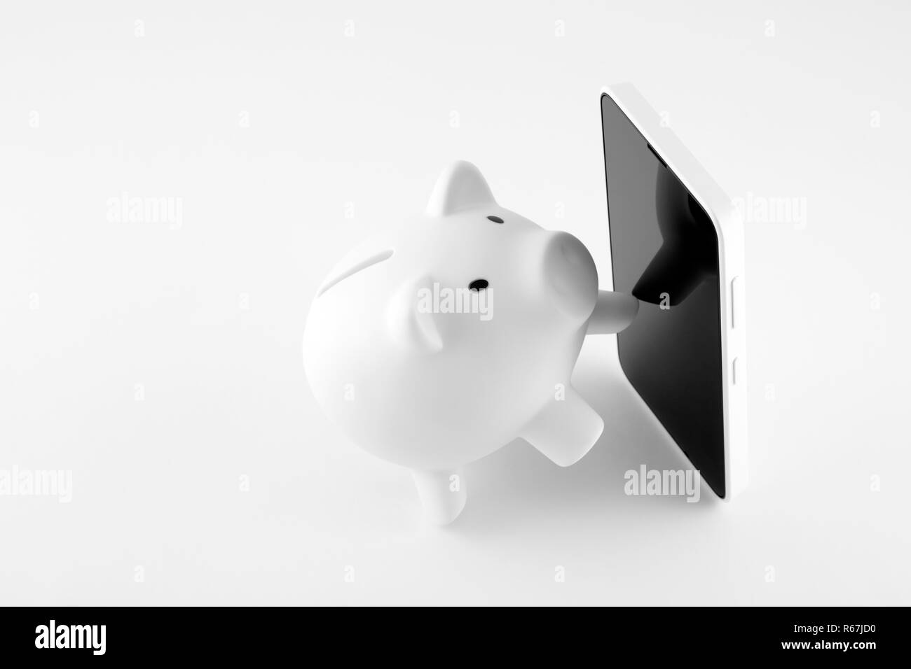 White piggy bank with mobile phone on white background Stock Photo - Alamy