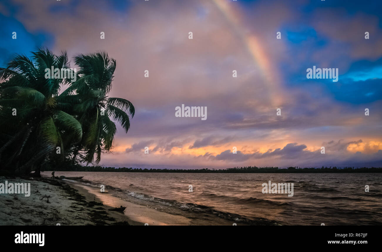 Rainbow over the ocean Stock Photo - Alamy