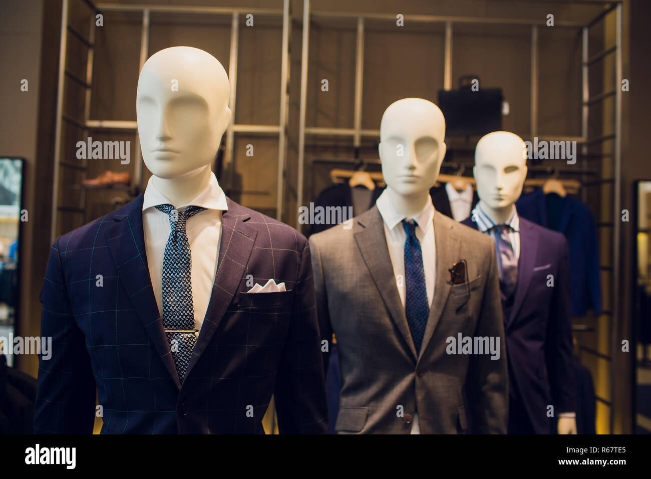 Two male mannequins dressed in suit. No brand names or copyright objects. Stock Photo