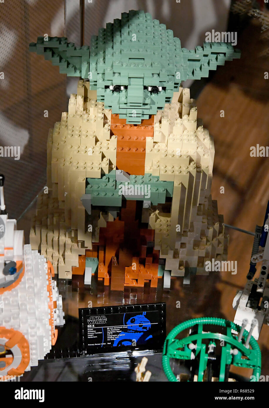 04 December 2018, Lower Saxony, Celle: The figure of Yoda belongs to the space ship worlds made of Lego bricks with the exhibition focus 'Star Wars' in the Bomann-Museum Celle. Around one thousand models have been set up on over 500 square metres of exhibition space. The works come from one of the largest private collections in Germany, the Lange family collection in neighbouring Eschede. A special feature of the show, which will be open until 11 June next year, are three virtual hands-on stations: Space stations in which visitors can transport themselves and their spaceships into space. The e Stock Photo