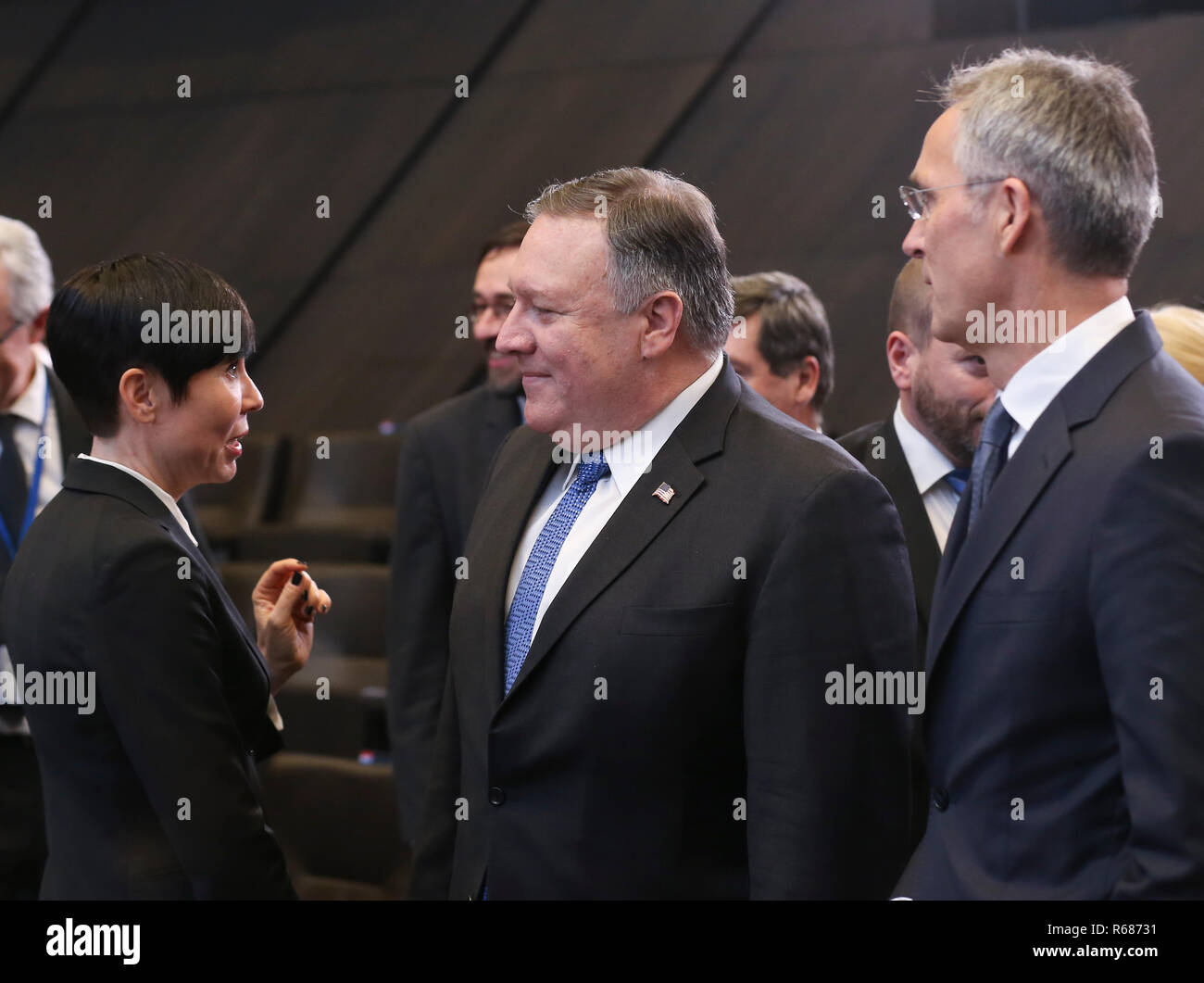 Brussels, Belgium. 4th Dec, 2018. U.S. Secretary of State Mike Pompeo (C) talks with Norwegian Foreign Minister Ine Marie Eriksen Soreide (L) as NATO Secretary General Jens Stoltenberg (R) stands by during a session of the NATO foreign ministers' meeting with their Georgian and Ukrainian counterparts in Brussels, Belgium, Dec. 4, 2018. Credit: Ye Pingfan/Xinhua/Alamy Live News Stock Photo