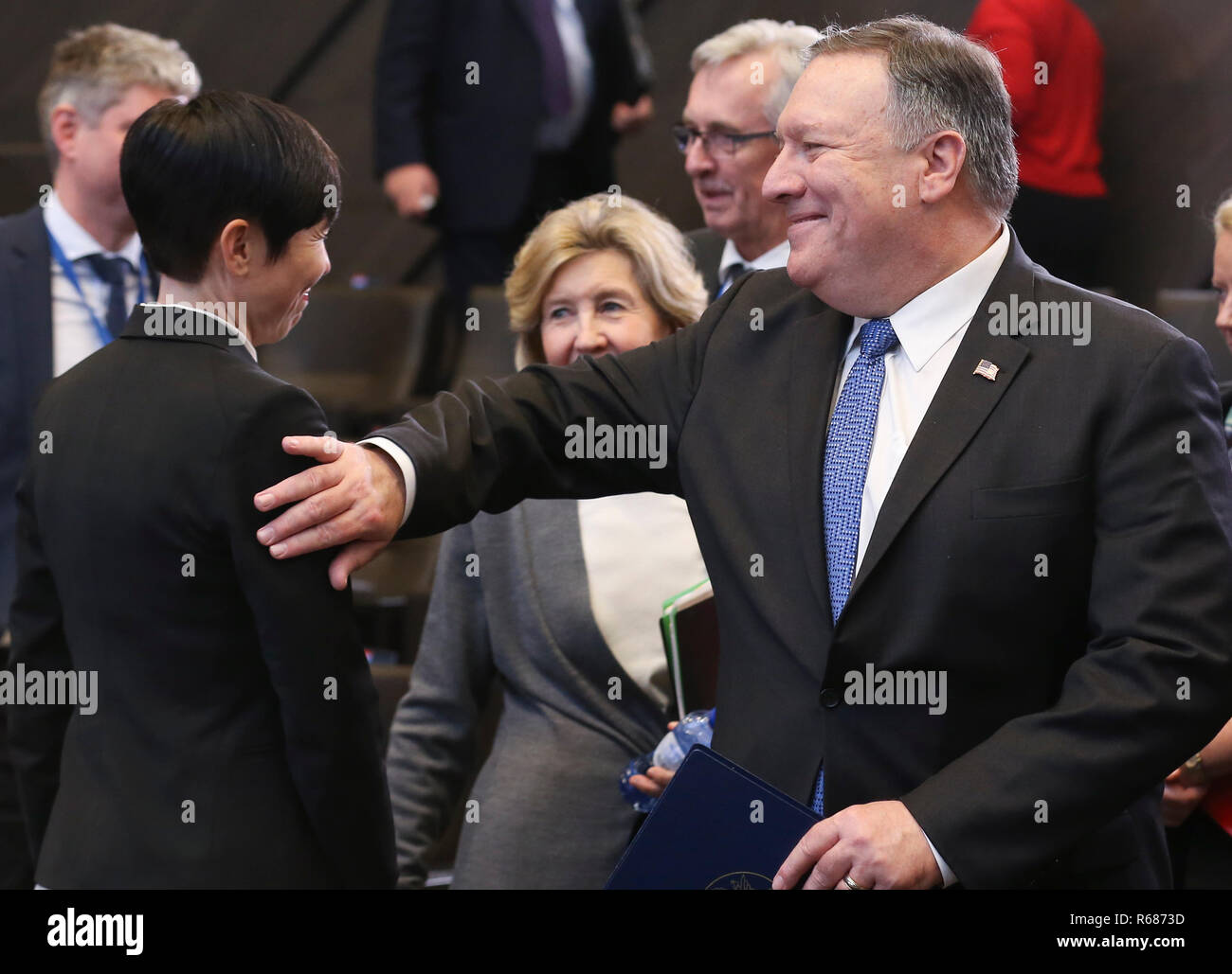 Brussels, Belgium. 4th Dec, 2018. U.S. Secretary of State Mike Pompeo (R) greets Norwegian Foreign Minister Ine Marie Eriksen Soreide during a session of the NATO foreign ministers' meeting with their Georgian and Ukrainian counterparts in Brussels, Belgium, Dec. 4, 2018. Credit: Ye Pingfan/Xinhua/Alamy Live News Stock Photo