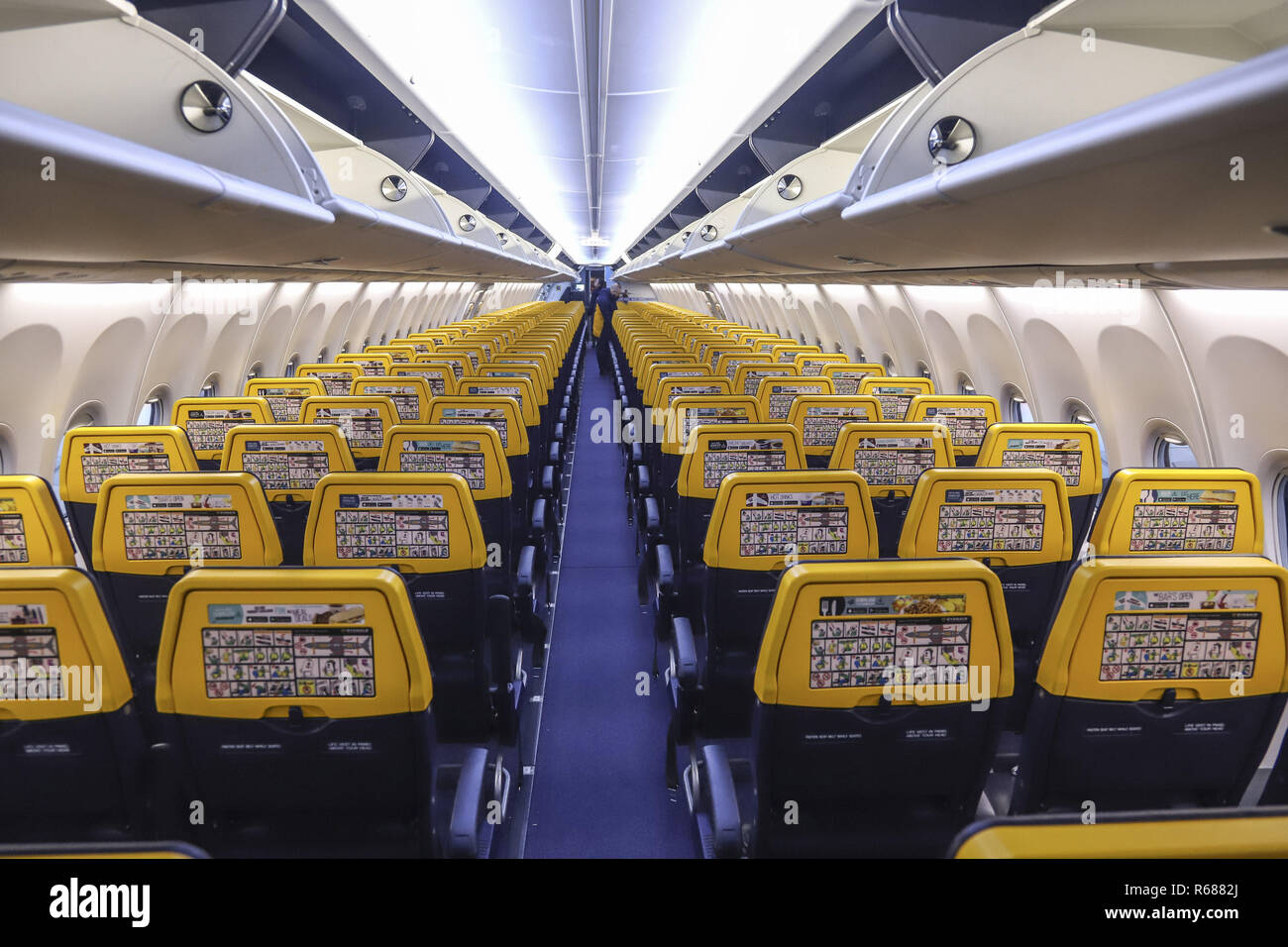 The new Boeing Sky Interior cabin of Ryanair. the aircraft is a Boeing 737-800  specifically a Boeing 737 Next Gen or 737-8AS(WL) with registration EI-FZL.  Ryanair is a low cost carrier based