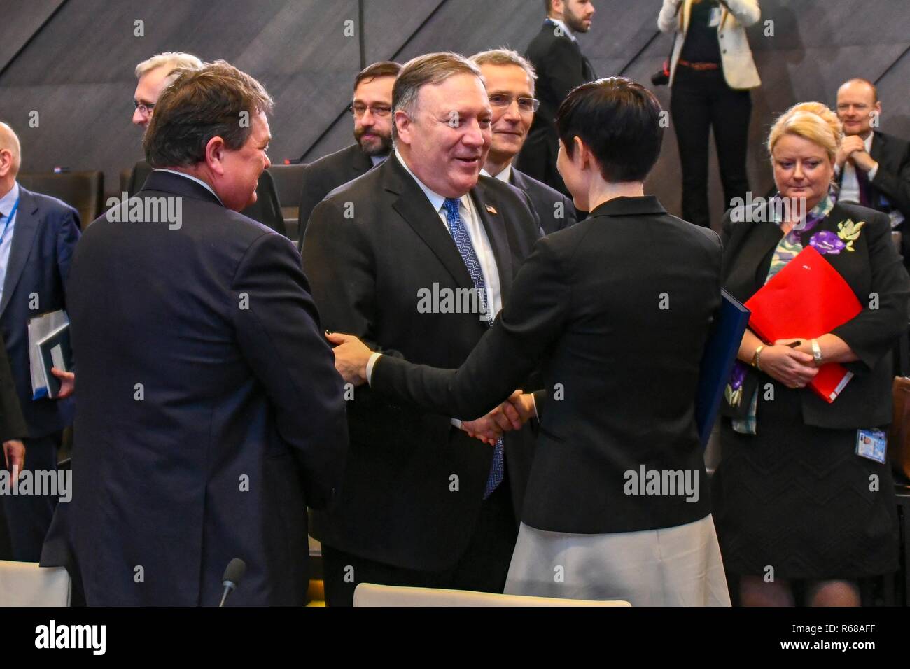 Brussels, Belgium. 4th Dec 2018. U.S. Secretary State Mike Pompeo, center, chats with Norwegian Foreign Affairs Ine Eriksen Soreide, right, before the start of the North Atlantic Council meeting on Georgia and Ukraine at NATO headquarters December 4, 2018 in Brussels, Belgium. Credit: Planetpix/Alamy Live News Stock Photo
