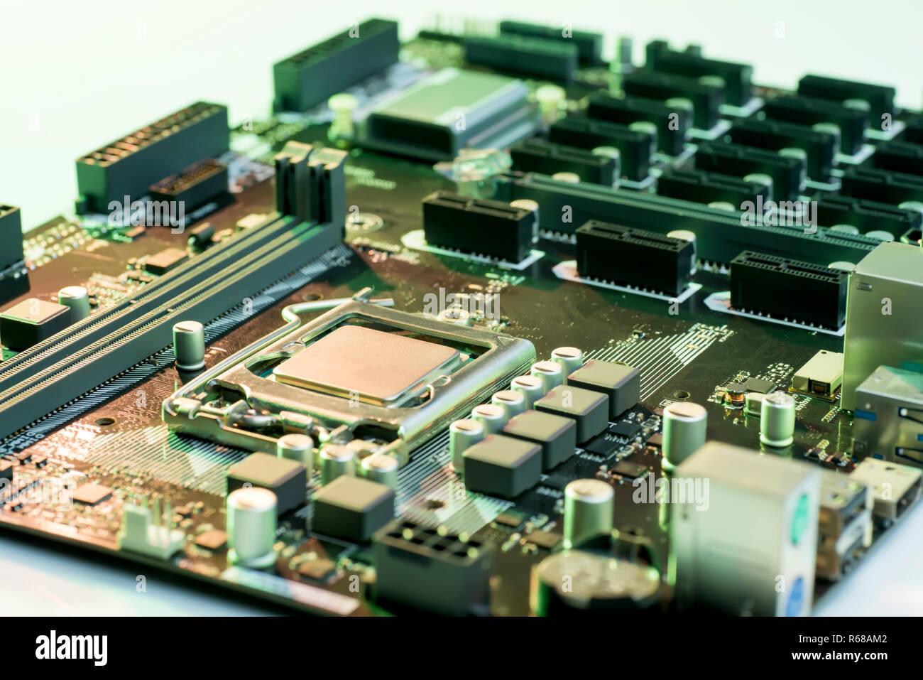 Close up view of computer motherboard with processor, memory and PCI slots  on the table Stock Photo - Alamy
