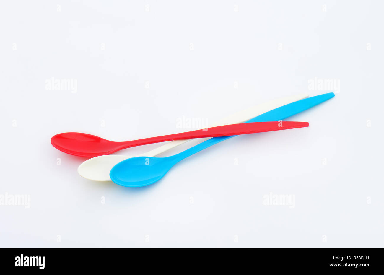 Three long plastic spoons Stock Photo Alamy