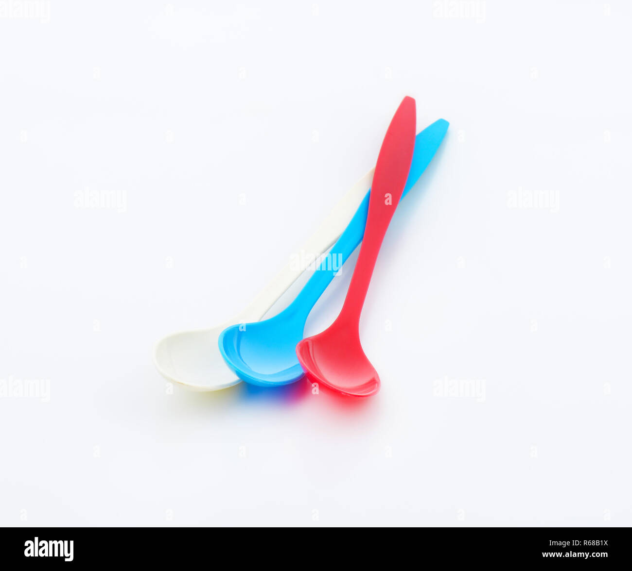 Three long plastic spoons Stock Photo Alamy