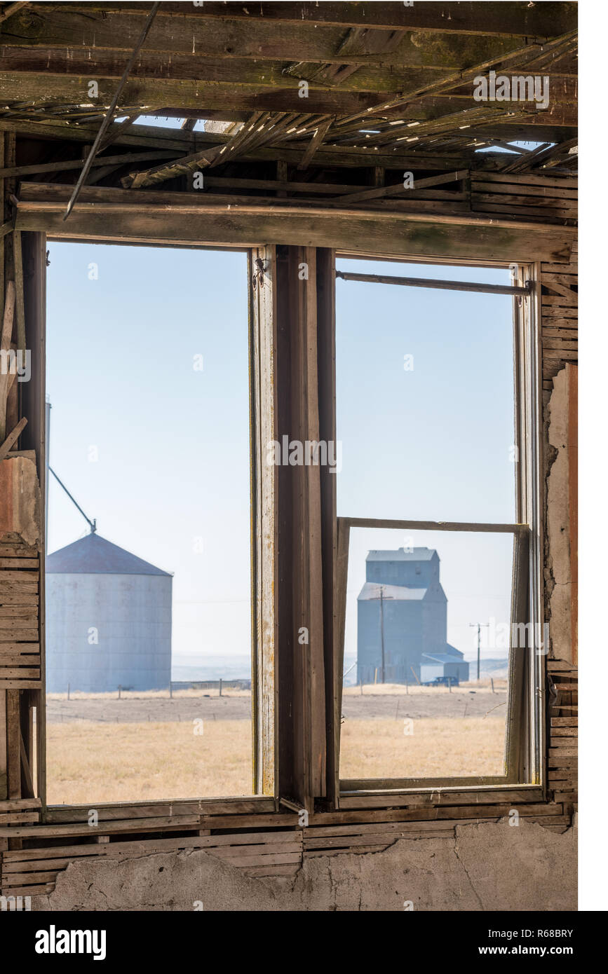View of a grain elevator from the old schoolhouse in Govan, Washington. Stock Photo