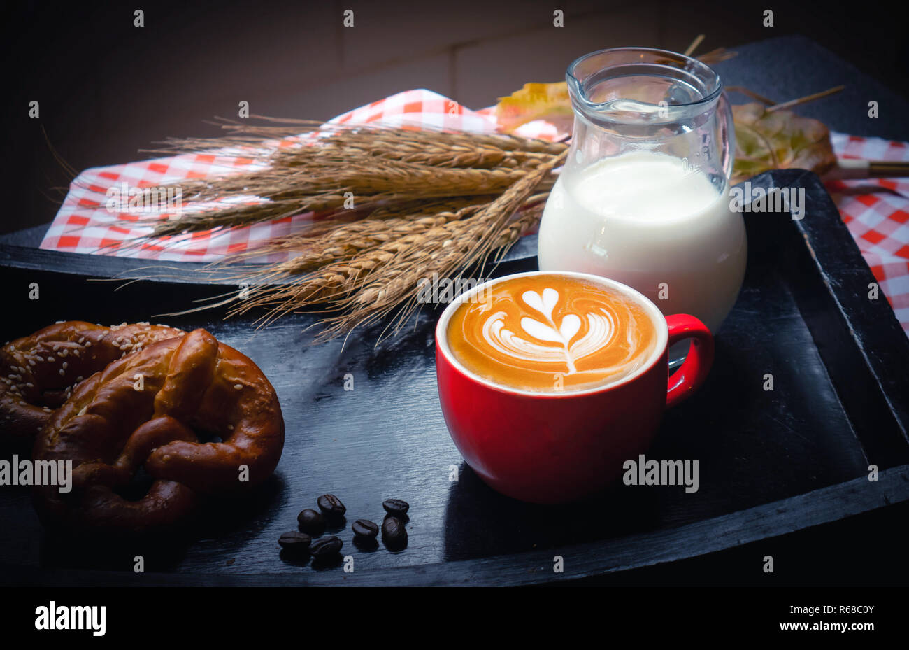 Breakfast with bread,latte art and milk on plate Stock Photo